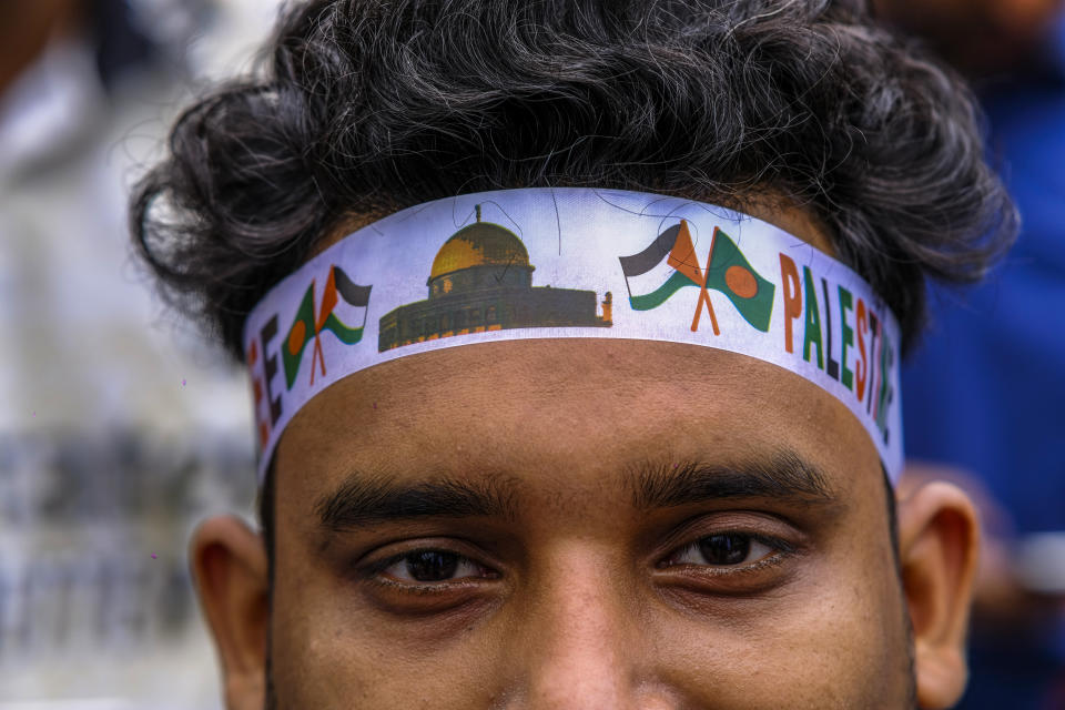 A student wearing headband looks on as Bangladeshi students march during a pro- Palestinian demonstration at the Dhaka University area in Dhaka, Bangladesh, Monday, May 6, 2024. (AP Photo/ Mahmud Hossain Opu )