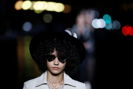 A model presents a creation by designer Anthony Vaccarello as part of his Spring/Summer 2019 women's ready-to-wear collection show for fashion house Saint Laurent during Paris Fashion Week in Paris, France, September 25, 2018. REUTERS/Stephane Mahe