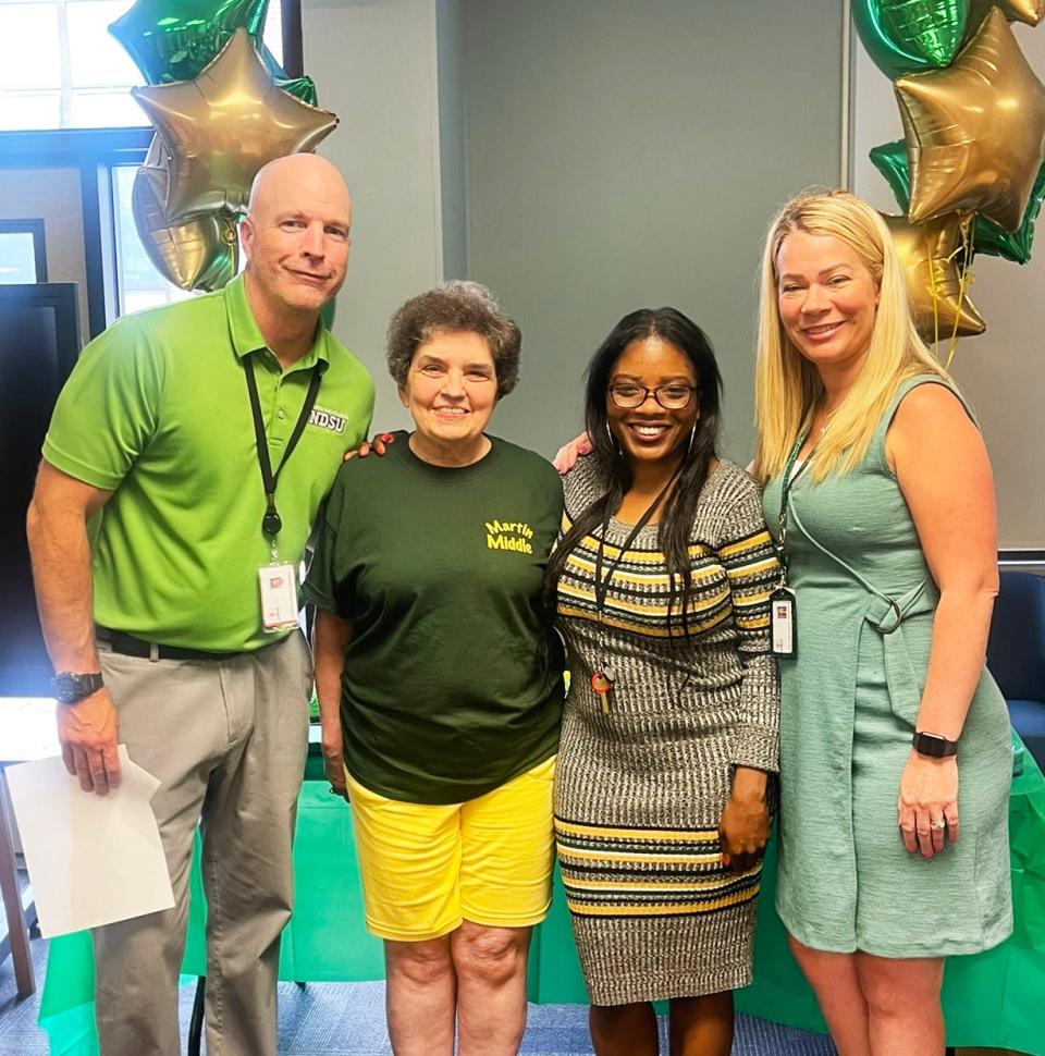 From left, Assistant Principal Jeffrey Kelly, Nancy Delaney, Assistant Principal Cassie Sermon and Principal Jaimie Pereira at the 50th anniversary celebration at the Joseph H. Martin Middle School in Taunton on Tuesday, Sept. 13, 2022.
