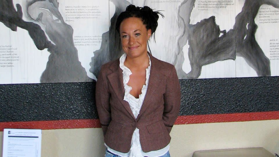 Rachel Dolezal, then a leader of the Human Rights Education Institute, stands in front of a mural she painted at the institute's offices in Coeur d'Alene, Idaho, on July 24, 2009. - Nicholas K. Geranios/AP
