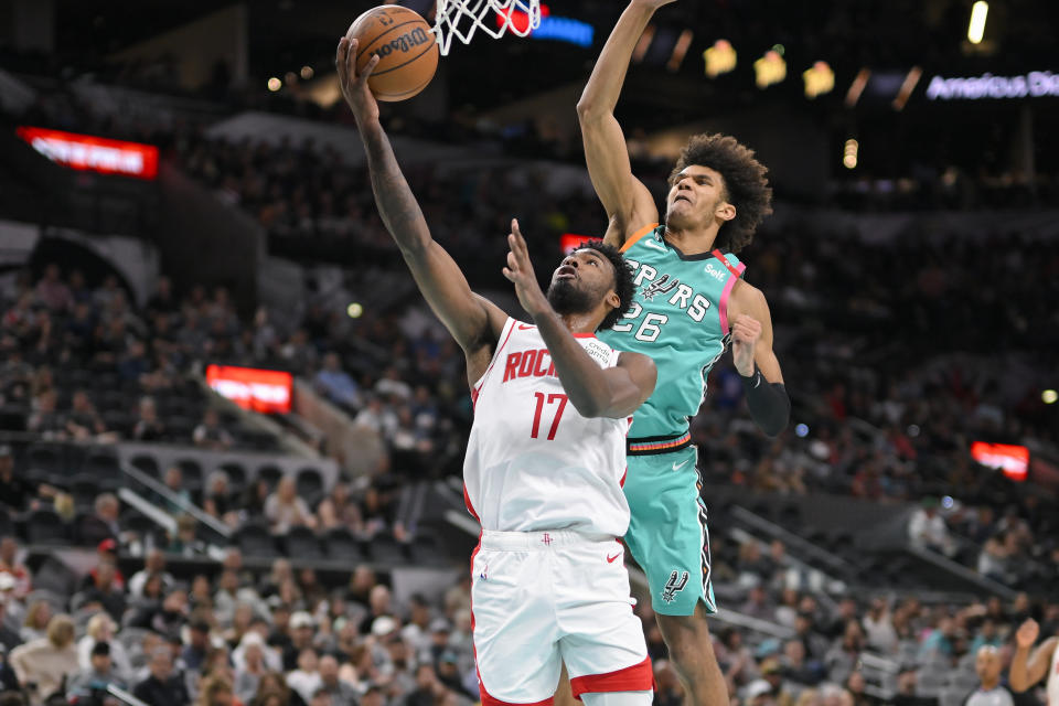 Houston Rockets' Tari Eason (17) goes to the basket against San Antonio Spurs' Dominick Barlow during the first half of an NBA basketball game, Saturday, March 4, 2023, in San Antonio. (AP Photo/Darren Abate)