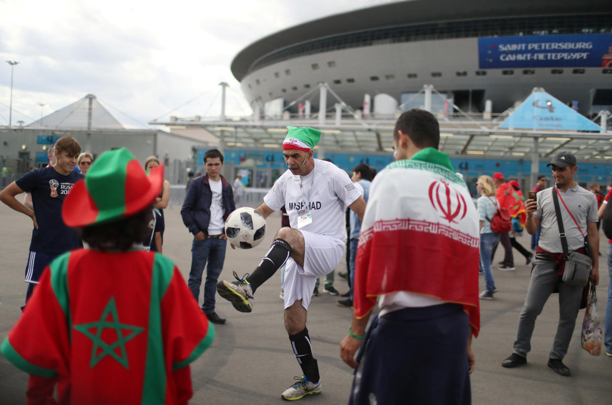 Soccer Football – World Cup – Group B – Morocco vs Iran – Saint Petersburg Stadium, Saint Petersburg, Russia – June 15, 2018 Iran fans play football outside the stadium before the match REUTERS/Pilar Olivares