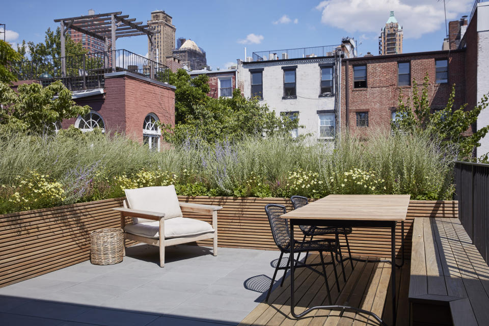 A backyard with ornamental grasses used as privacy