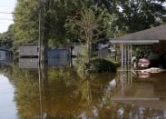 A flood damaged neighborhood is seen in St. Amant, Louisiana. REUTERS/Jonathan Bachman