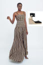 <p>She’s wearing the “Pleated Stripe Long Dress” from Martin Grant, and “Carina canvas wedge espadrilles” by Castañer. </p>