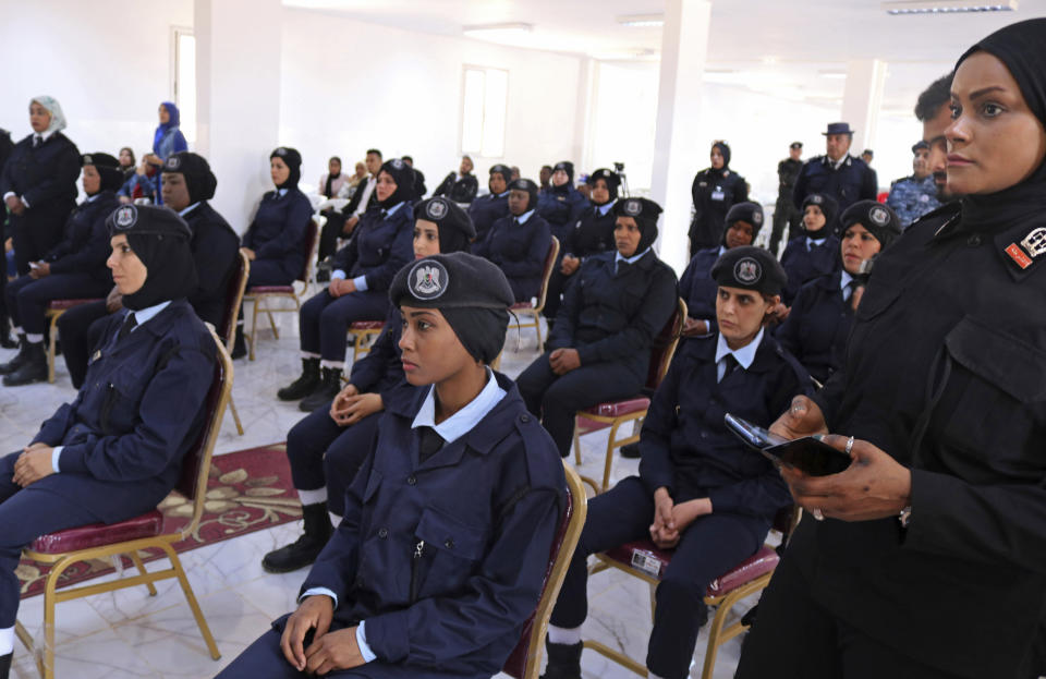 In this May 2, 2019 photo, policewomen cadets attend their graduation ceremony in Benghazi, Libya. After years of assassinations, bombings and militia firefights, Libya’s eastern city of Benghazi finally feels safe again -- but security has come at a staggering cost. Forces loyal to Khalifa Hifter, who now controls eastern Libya, have cracked down on dissent. In a report issued last month, the Tripoli-based Libyan Center for Freedom of the Press documented 29 attacks on reporters by Hifter’s forces over the past year and a half, more than any other armed group. (AP Photo/Rami Musa)