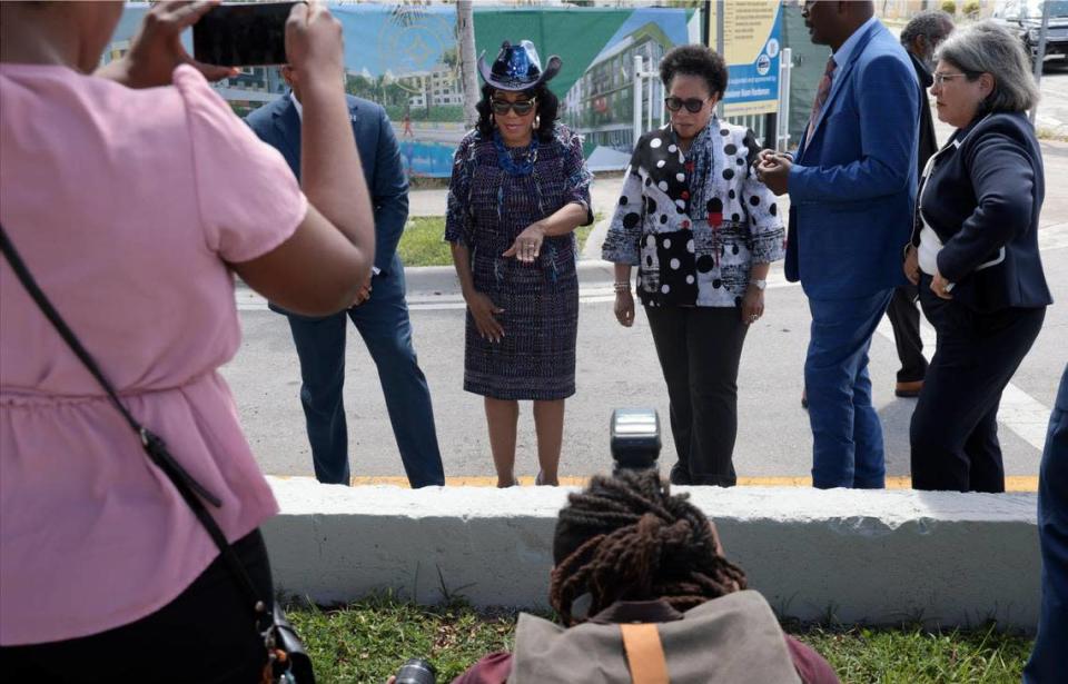 Congresswomen Frederica Wilson, center-left, spotlights a wall that once segregated the neighborhood during a visit to the new development in Liberty Square by Housing and Urban Development Secretary Marcia Fudge, center-right. Fudge visited Miami during a time of surging rents and house prices and toured Liberty Square in Miami’s Liberty City neighborhood on Tuesday, June 28, 2022.