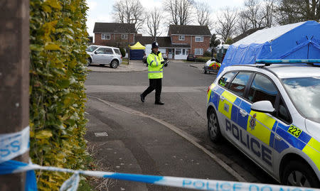 Police officers stand guard outside the home of Sergei Skripal in Salisbury, Britain, March 8, 2018. REUTERS/Peter Nicholls