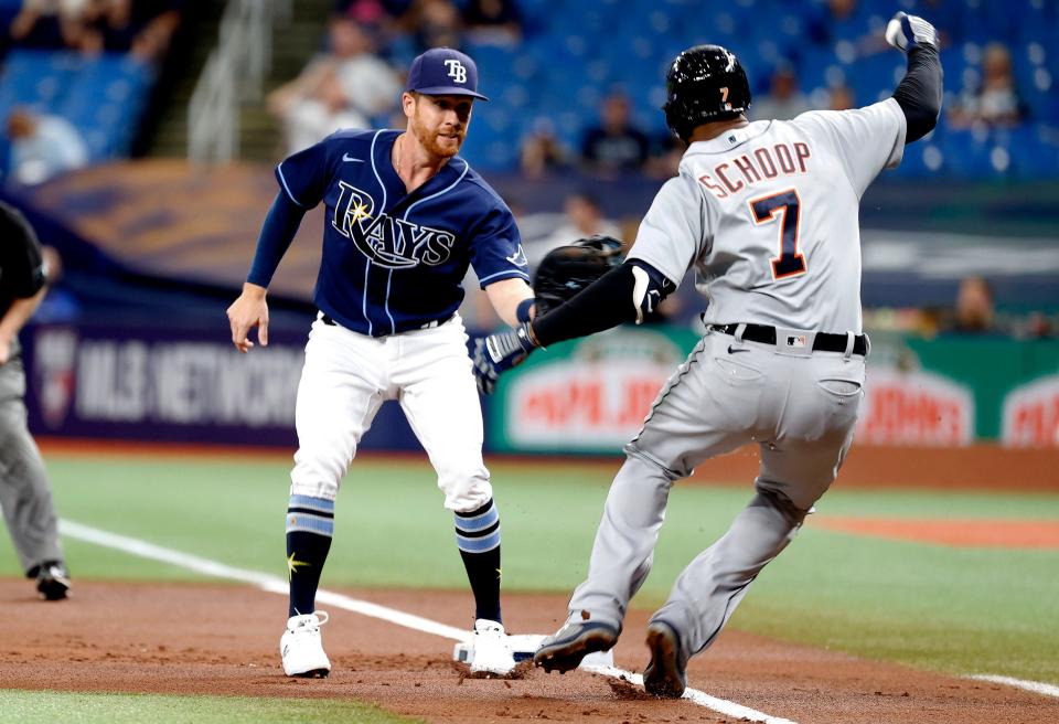 Tampa Bay Rays right fielder Jordan Luplow (25) tags out Detroit Tigers second baseman Jonathan Schoop (7) during the first inning at Tropicana Field in St. Petersburg, Florida, on Thursday, Sept. 16, 2021.