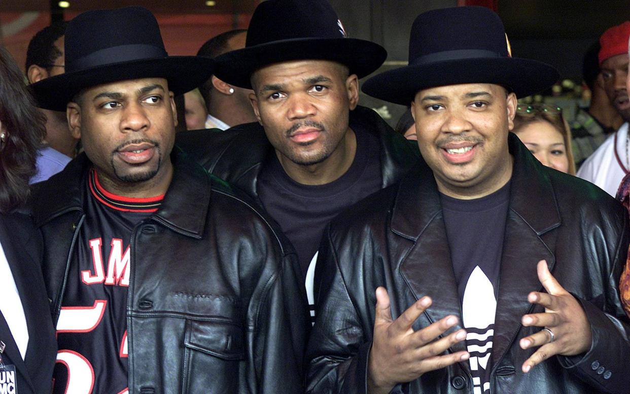 Members of the musical group RUN-DMC (L to R) Jason Mizell (Jam Master Jay), Darryl McDaniels (DMC) and Joseph Simmons (DJ Run) back in 2002 - Adrees Latif 