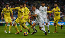 Soccer Football - La Liga Santander - Real Madrid vs Villarreal - Santiago Bernabeu, Madrid, Spain - January 13, 2018 Real Madrid’s Lucas Vazquez in action with Villarreal's Manu Trigueros REUTERS/Javier Barbancho