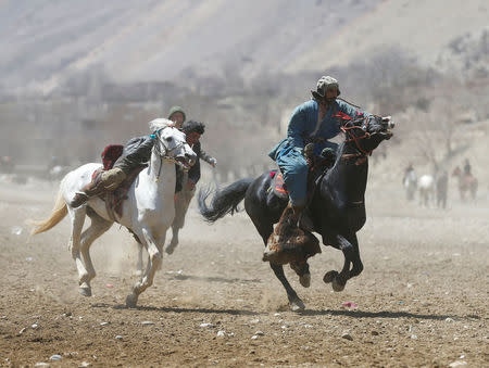 Afghan horsemen compete during a Buzkashi game in Panjshir province, north of Kabul, Afghanistan April 7, 2017. REUTERS/Omar Sobhani