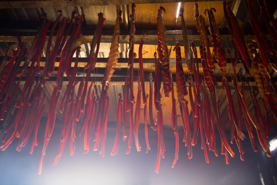 Strips of salmon are seen hanging in a smokehouse on the Kuskokwim River on July 19, 2017. (Photo provided by U.S. Fish and Wildlife Service)