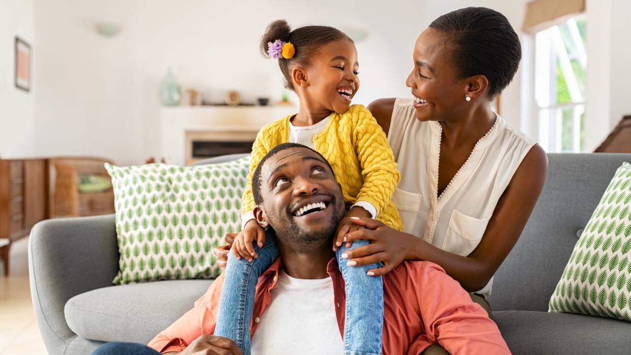 Family laughing together at home