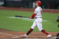 Cincinnati Reds' Joey Votto watches his two-run home run duirng the first inning of the team's baseball game against the Milwaukee Brewers in Cincinnati, Wednesday, Sept. 23, 2020. (AP Photo/Aaron Doster)