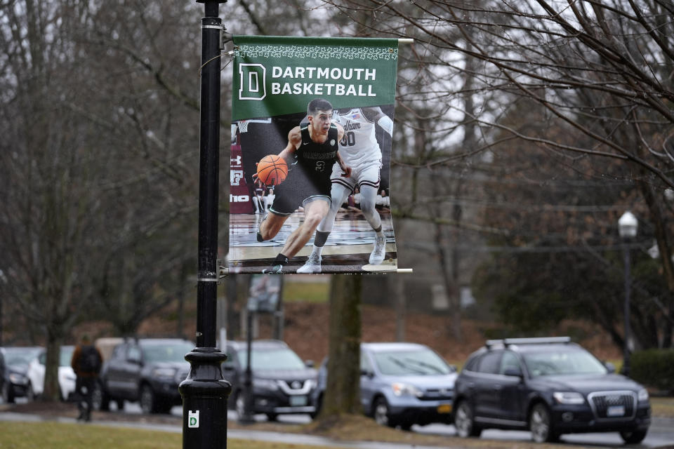 A poster of a basketball player is attached to a lamppost on the campus of Dartmouth College, Tuesday, March 5, 2024, in Hanover, N.H. Dartmouth basketball players voted to form a union, an unprecedented step in the continued deterioration of the NCAA's amateur business model. (AP Photo/Robert F. Bukaty)