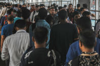 Indian commuters leave the Dadar train terminus in Mumbai, India, Tuesday, July 23, 2024. India’s finance minister Nirmala Sitharaman on Tuesday unveiled the first full annual budget of the newly elected government following the national election. (AP Photo/Rafiq Maqbool)