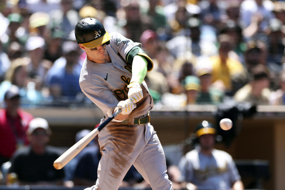 Oakland Athletics' Mark Canha hits an RBI single against the San Diego Padres in the fourth inning of a baseball game Wednesday, July 28, 2021, in San Diego. (AP Photo/Derrick Tuskan)