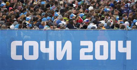 People queue to enter the stadium before the opening ceremony of the 2014 Sochi Winter Olympics, February 7, 2014. REUTERS/Mark Blinch