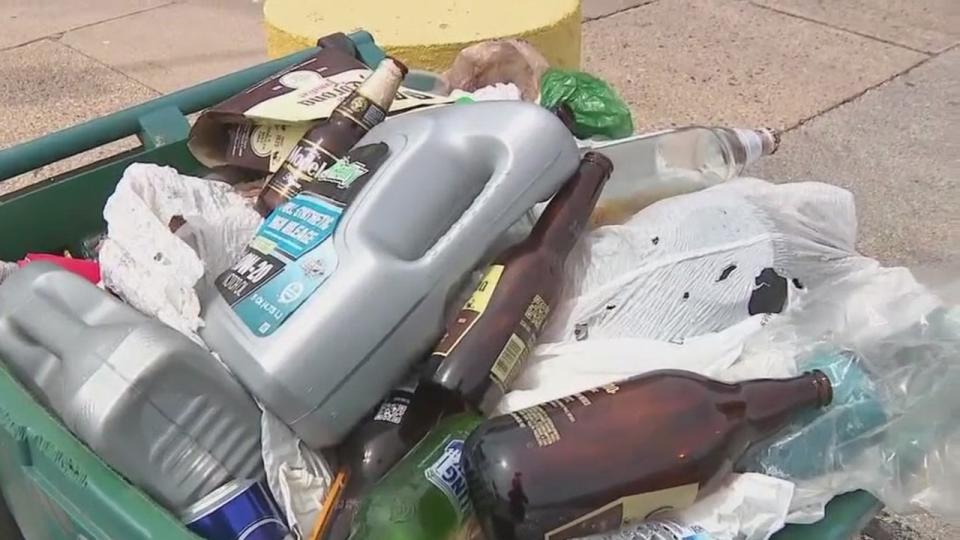 <div>Filling bins with garbage and recyclables.</div>