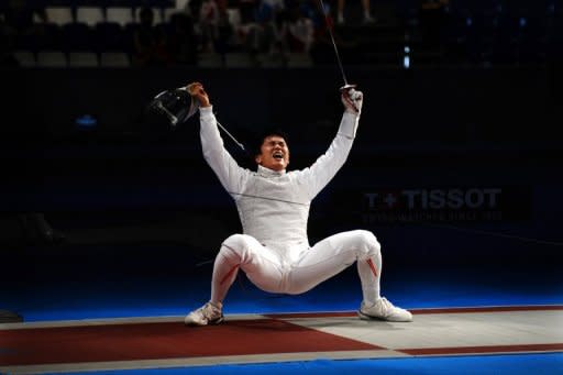 Thisd file photo shows Kenta Chida of Japan celebrating his team's victory against the US during their Men's Team Foil quarter-final at the World Fencing Championship in Antalya, in 2009. Chida learned that his hometown, the major fishing port of Kesennuma, was devastated by last year's tsunami when he was on the road in Germany