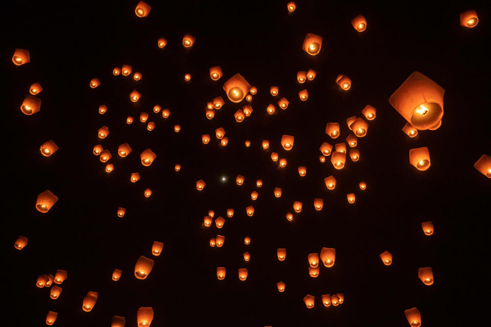 Lanterns are lit and released into the night sky during the Pingxi Sky Lantern Festival in New Taipei City, Taiwan, on Feb. 5, 2023. 