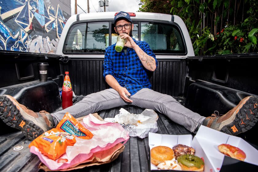 LOS ANGELES, CA - MAY 30: Portrait of Danny Palumbo as he enjoys some food in the back of his pickup behind Highland Theatres on Tuesday, May 30, 2023 in Los Angeles, CA. (Mariah Tauger / Los Angeles Times)