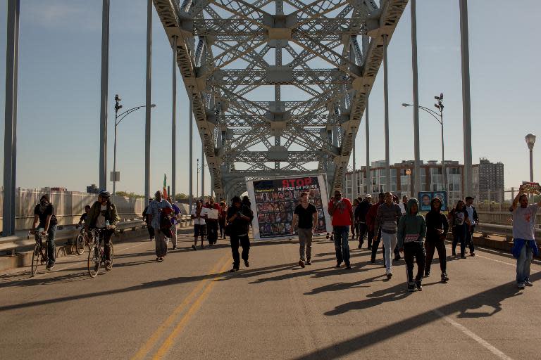 Protestors march across the Detroit Superior Bridge as people take to the streets and protest in reaction to Cleveland police officer Michael Brelo being acquitted of manslaughter charges, May 23, 2015 in Cleveland, Ohio