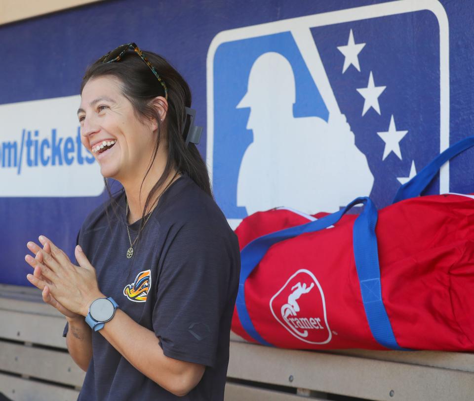 Ducks assistant athletic trainer Karina Gonzalez talks in the dugout before the game against the Erie SeaWolves earlier this week.