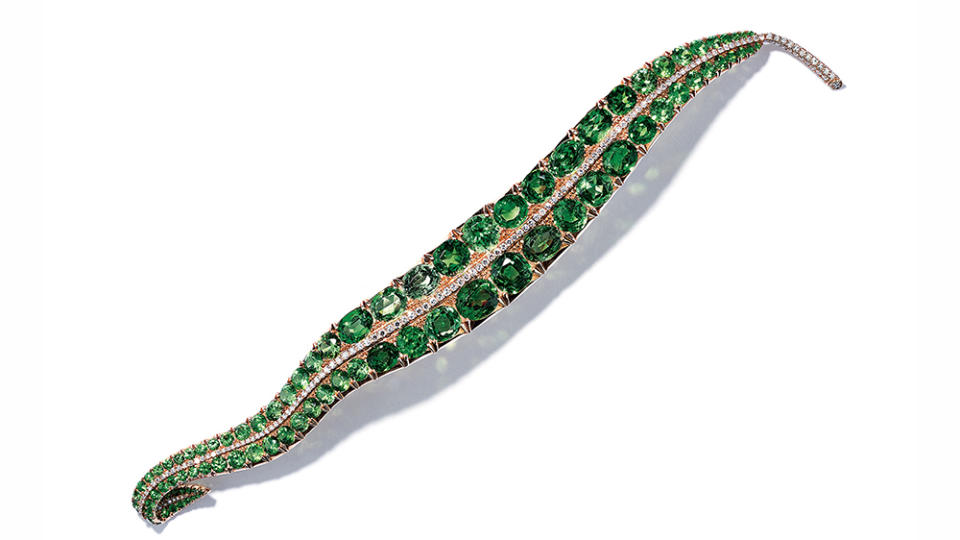 Pea-Leaf brooch in 18-karat yellow gold with demantoid garnets and diamonds. - Credit: Adam Norton at Jak Jaes Ltd