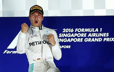 Formula One - F1 - Singapore Grand Prix - Marina Bay, Singapore- 18/9/16 Mercedes' Nico Rosberg of Germany celebrates winning the race . REUTERS/Jeremy Lee