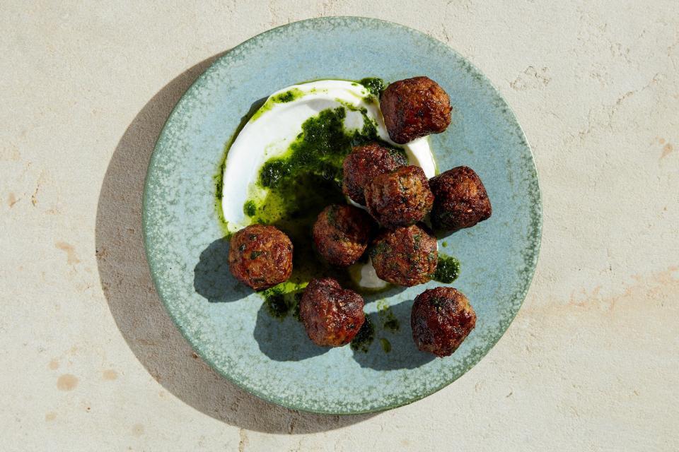 <h1 class="title">Spicy Lamb Meatballs with Raisin Pesto</h1><cite class="credit">Photo by Stephen Kent Johnson, Prop Styling by Kalen Kaminski, Food Styling by Rebecca Jurkevich</cite>