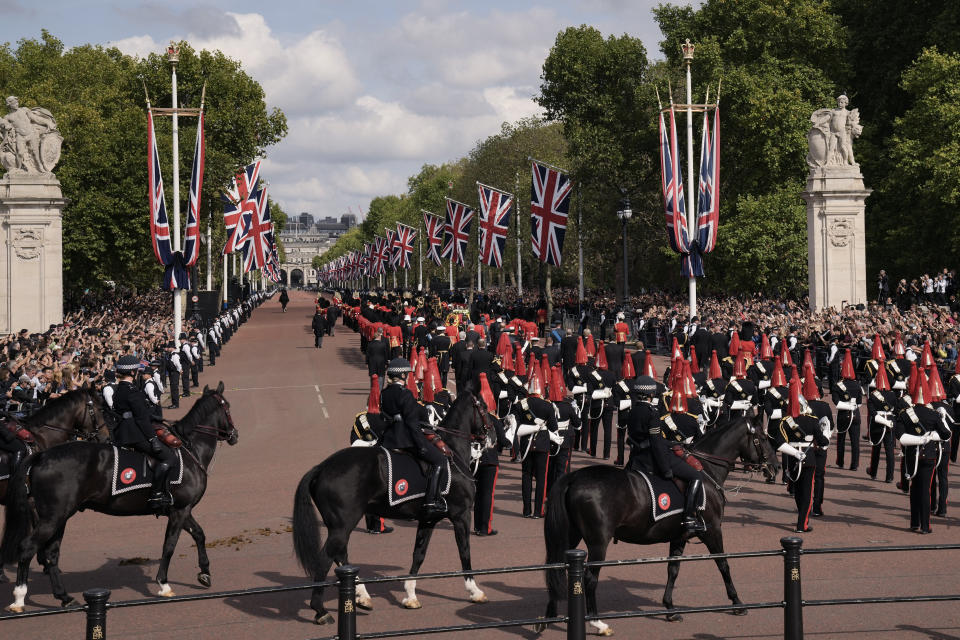 LONDON, ENGLAND - SEPTEMBER 14: The coffin of Queen Elizabeth II leaves Buckingham Palace for Westminster Hall during a ceremonial procession on September 14, 2022 in London, United Kingdom. Queen Elizabeth II's coffin is taken in procession on a Gun Carriage of The King's Troop Royal Horse Artillery from Buckingham Palace to Westminster Hall where she will lay in state until the early morning of her funeral. Queen Elizabeth II died at Balmoral Castle in Scotland on September 8, 2022, and is succeeded by her eldest son, King Charles III. (Photo by Vadim Ghirda - WPA Pool/Getty Images)