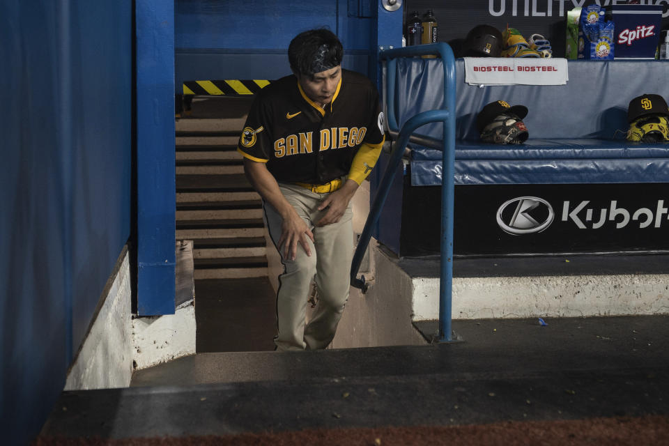 San Diego Padres second baseman Ha-Seong Kim steps into the dugout before the team's baseball game against the Toronto Blue Jays on Wednesday, July 19, 2023, in Toronto. (Chris Young/The Canadian Press via AP)