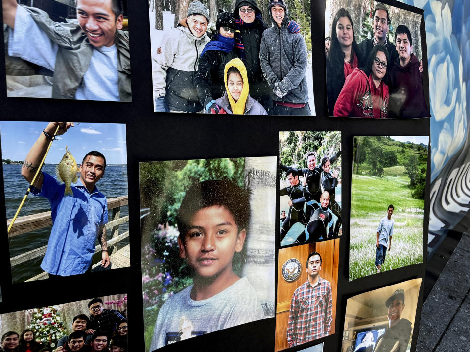 FILE - Photos of Angelo Quinto are displayed during a news conference in Oakland, Calif., Sept. 7, 2022. Family members of the Navy veteran who died in 2020 after a police officer pressed a knee to his neck for nearly five minutes while he was in a mental health crisis have settled a federal lawsuit against the Northern California city of Antioch for $7.5 million, their attorneys said Wednesday, May 15, 2024. (AP Photo/Janie Har, File)