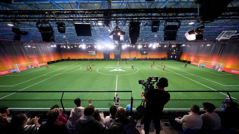 A cameraman is seen recording a Kings League match at the Cupra Arena.