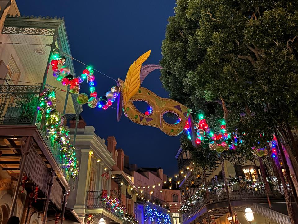 photo of a new orleans section of disneyland under a dark morning sky