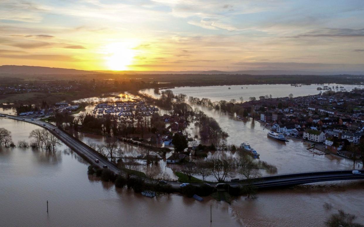 Flood water surrounding Upton upon Severn in Worcestershire in the wake of Storm Dennis last year - Steve Parsons /PA