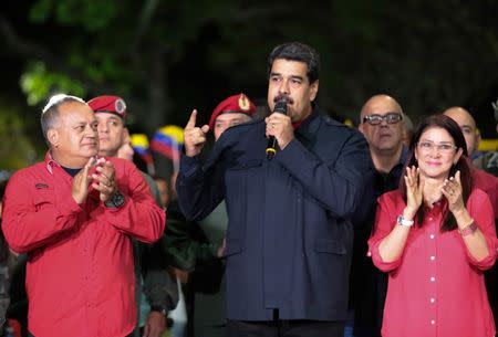 Venezuela's President Nicolas Maduro (C) speaks during a meeting with government members after the announcement of the results of the nationwide election for new governors in Caracas, Venezuela October 15, 2017. Miraflores Palace/Handout via REUTERS