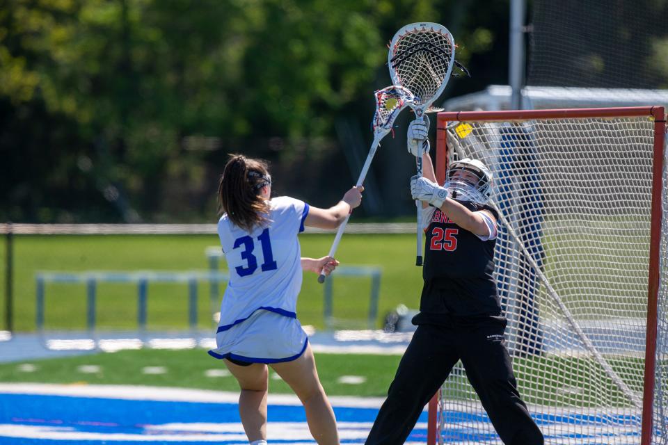 Shore's Teagan Harmon scores on Barnegat's Emalie Menegus during the first half of the Shore Conference Tournament game between Barnegat and Shore Regional at Shore Regional High School in West Long Branch, NJ Monday, May 9, 2022.