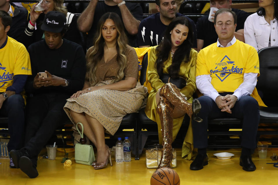 Beyonce, Jay-Z and Nicole Curran sitting together at the NBA finals game