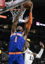 New York Knicks' Obi Toppin (1) shoots against San Antonio Spurs' Josh Primo during the first half of an NBA basketball game, Tuesday, Dec. 7, 2021, in San Antonio. (AP Photo/Darren Abate)