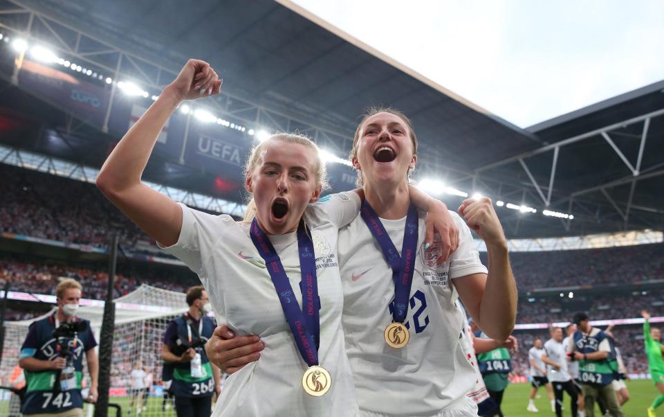 Chloe Kelly and Lotte Wubben-Moy of England celebrate victory after the UEFA Women's Euro 2022 final match between England and Germany at Wembley Stadium on July 31, 2022 in London, England. - Alex Livesey - UEFA/UEFA via Getty Images