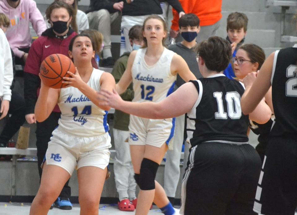 Mackinaw City senior Olivia Lidy (14) prepares to take a shot during the fourth quarter against Ellsworth on Thursday.