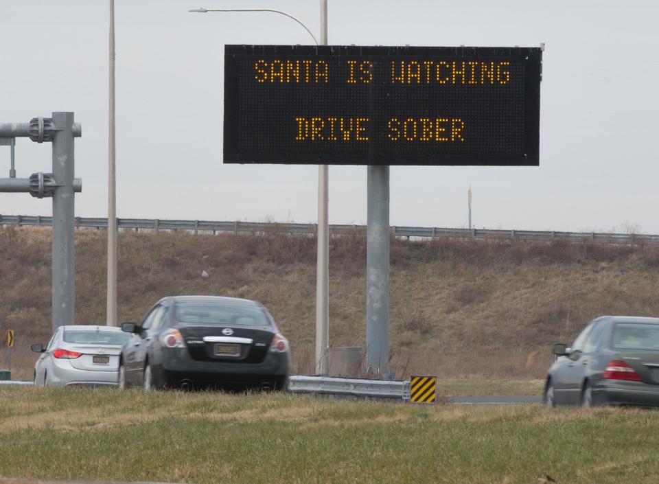 Drivers pass an electronic DelDOT sign, with a reference to Santa, along Delaware Route 1 south of Milford in this file photo.