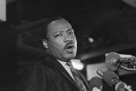 <p>Caught in a somber mood, Dr. Martin Luther King addresses some 2,000 people at the Mason Temple in Memphis, Tenn., April 3, 1968. (Photo: Bettmann/Getty Images </p>