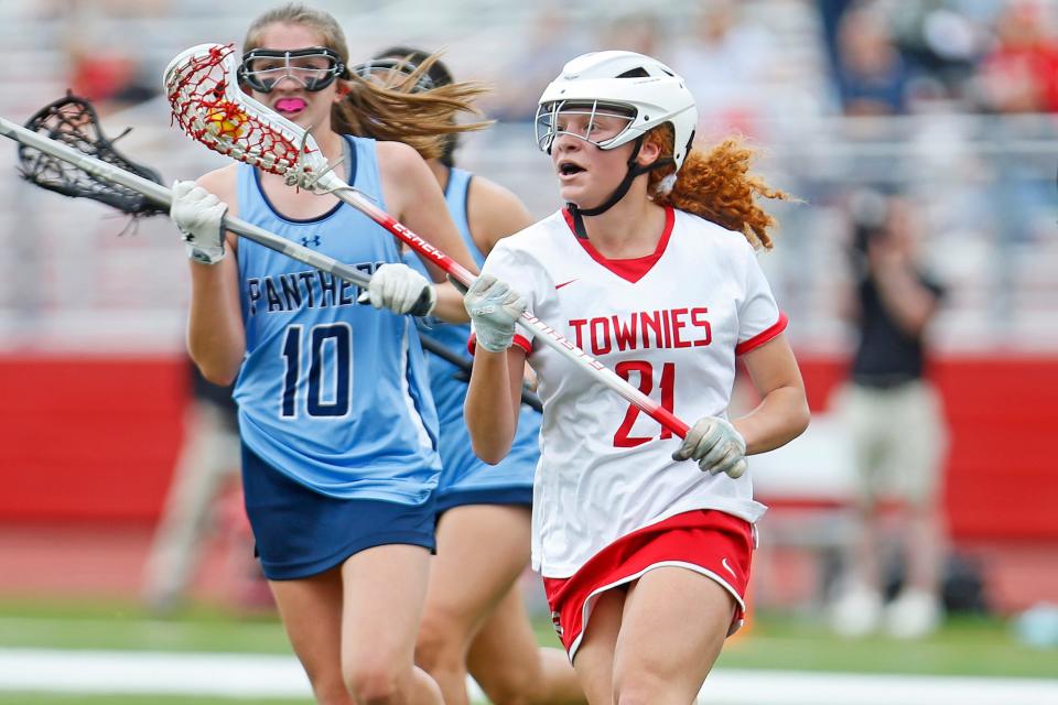 East Providence's Kenna Wigginton, in action here two years ago, scored 6 goals on Friday, including the 100th of her high school carrier, as she led the Townies to a 15-5 victory over PCD.