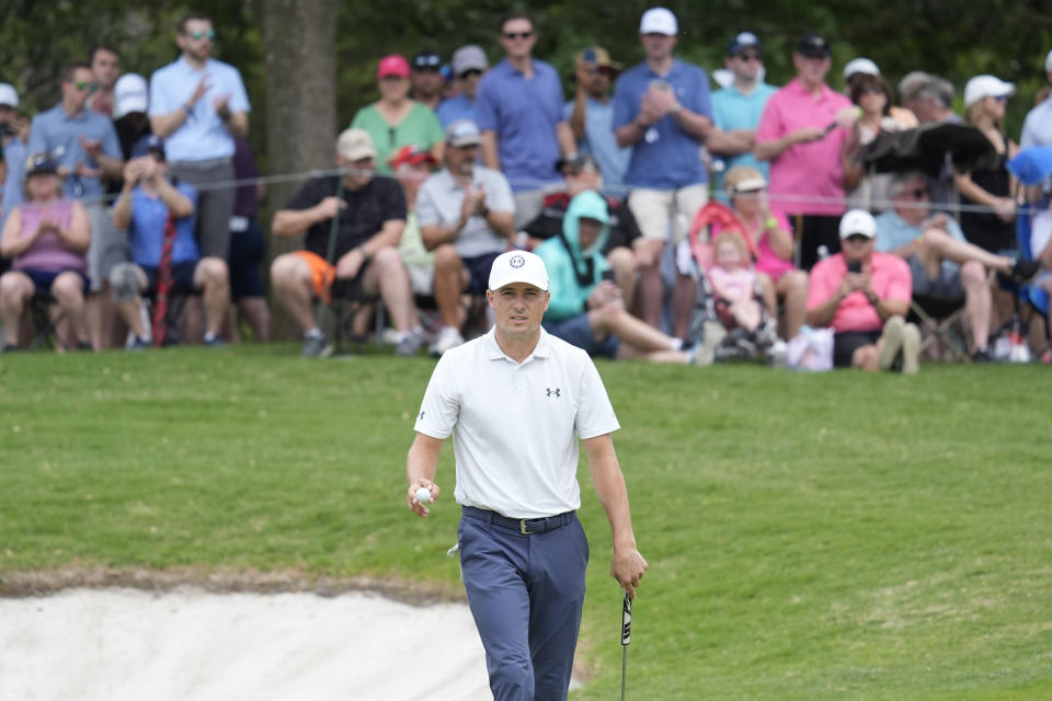 Jordan Spieth gestures as the gallery applauds his putt on the sixth green during the second round of the Byron Nelson golf tournament in McKinney, Texas, Friday, May 3, 2024. (AP Photo/LM Otero)