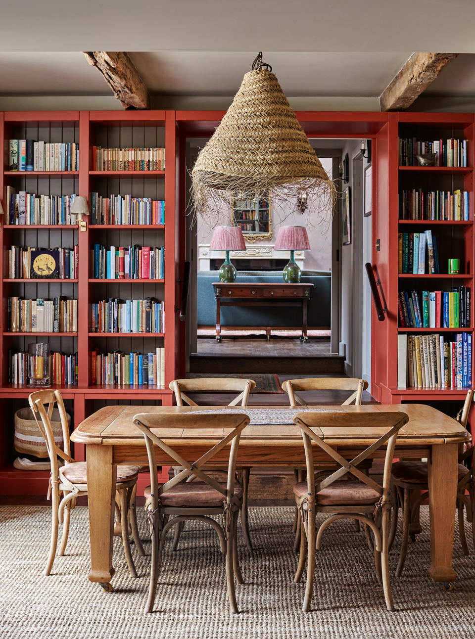 dining-room-with-bookshelves-and-rattan-lighting