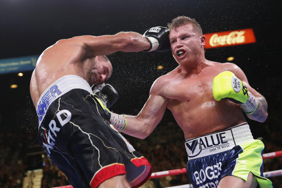 Canelo Alvarez, left, lands a punch against Sergey Kovalev during a light heavyweight WBO title bout, Saturday, Nov. 2, 2019, in Las Vegas (AP Photo/John Locher)